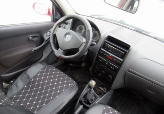 Подержанный автомобиль Fiat Albea 2007 года (13 фото)