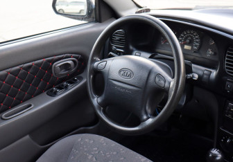 Подержанный автомобиль Kia Spectra Sedan 2008 года (12 фото)